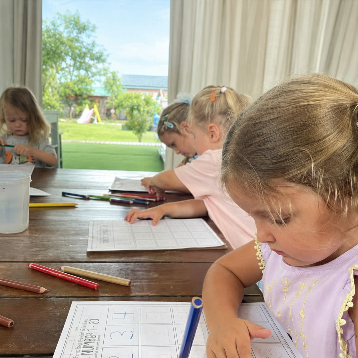 Children learning at Shining Stars Kindergarten Kamala