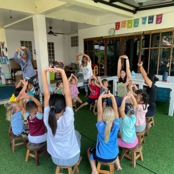 Children participating in circle time at Shining Stars Kindergarten Kamala