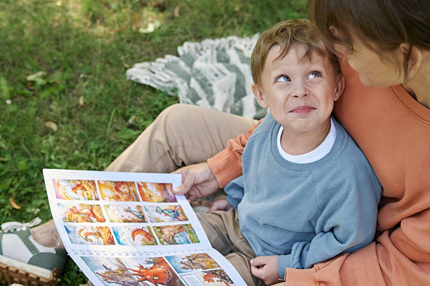 Parent and young child reading and learning together at home